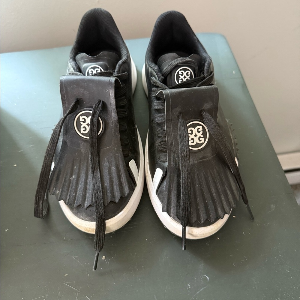 G/FORE Black and White Golf Sneakers with Modern Strap Design